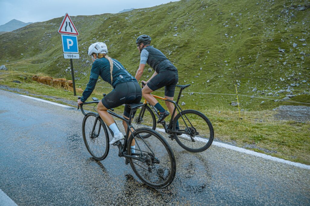 Two cyclists riding in the cold
